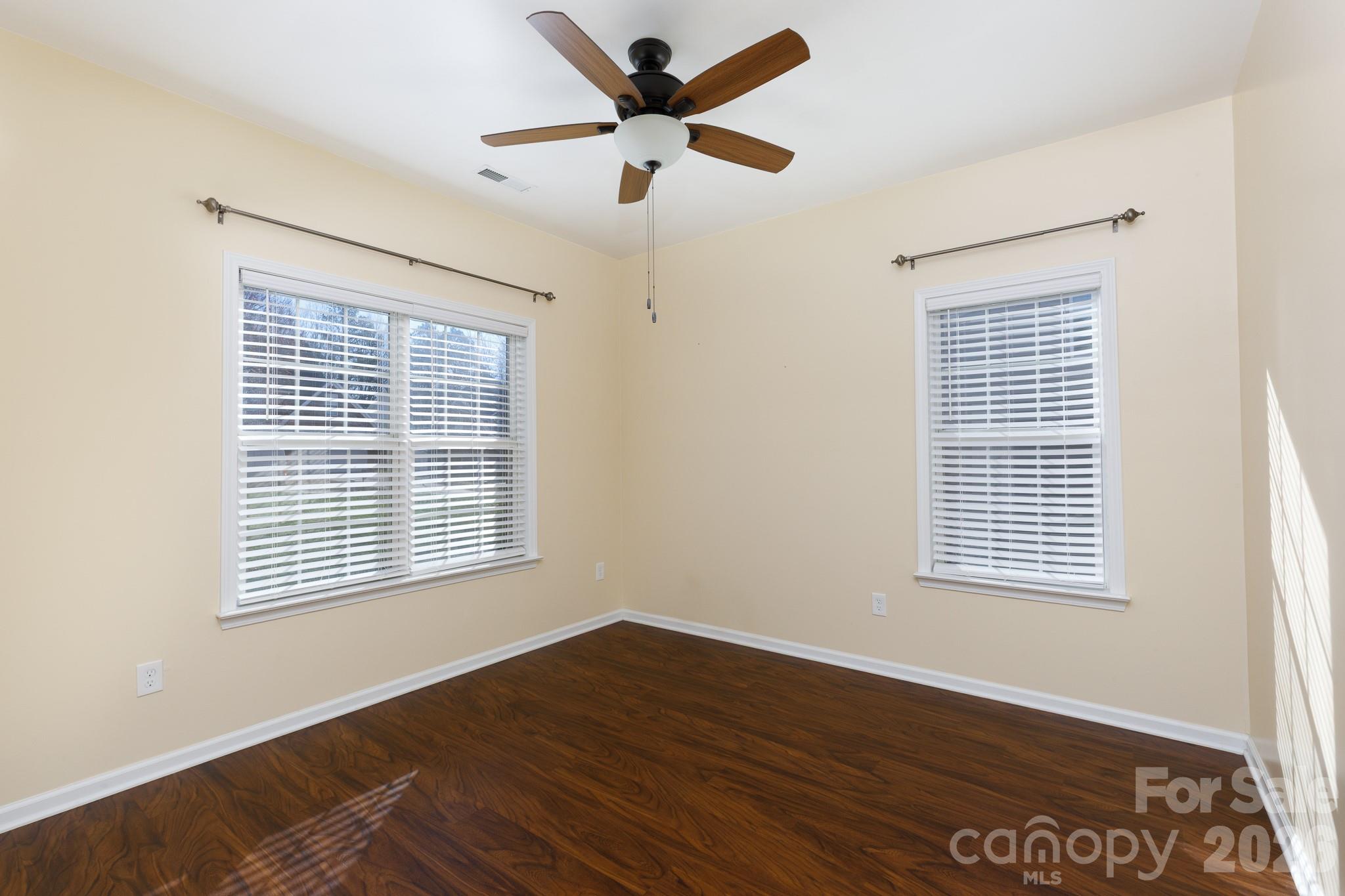 424 Elizabeth Valley Lane Clover, SC 29710 - Photo 3 of 27 a view of an empty room with wooden floor and a window