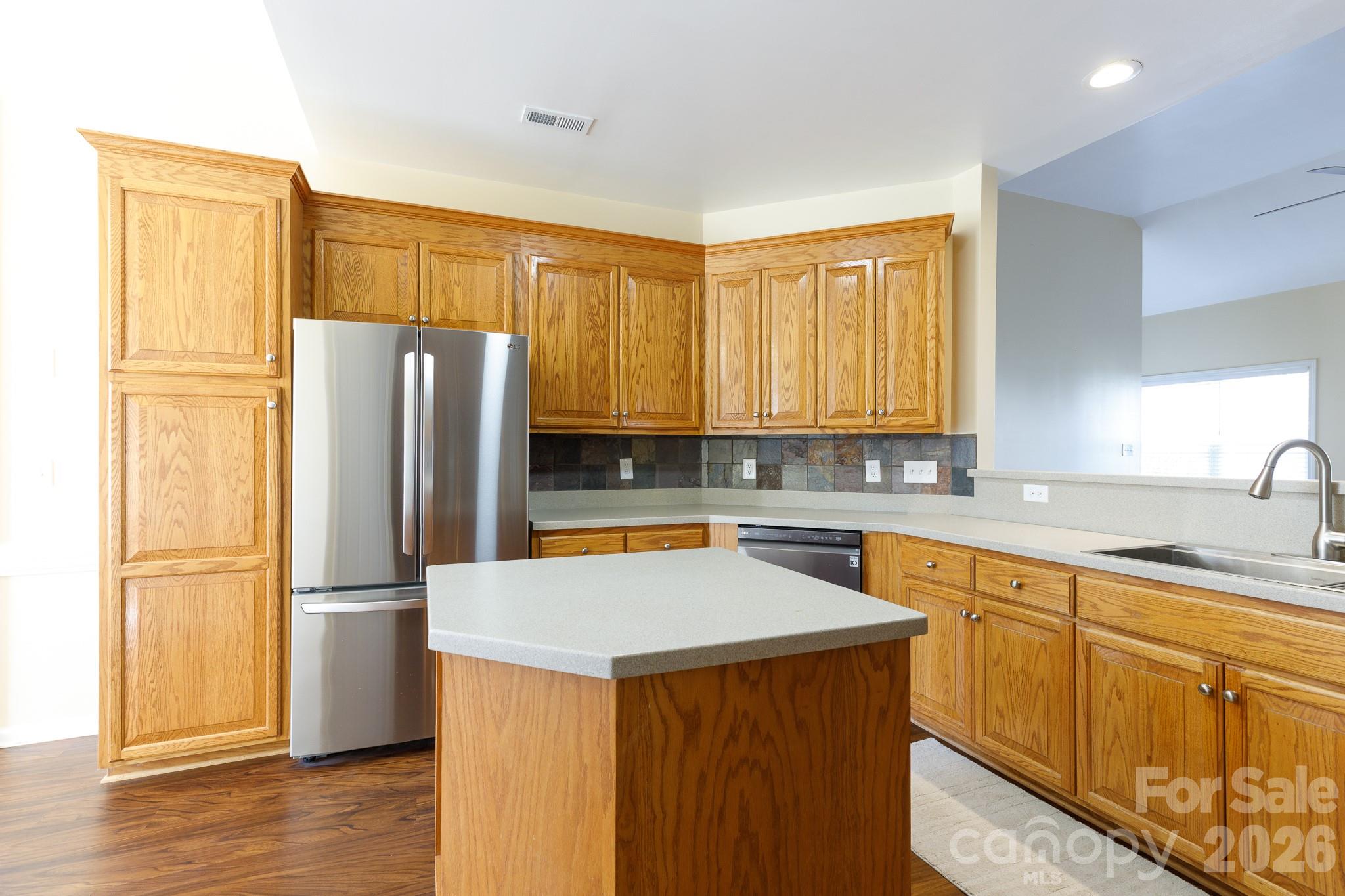 424 Elizabeth Valley Lane Clover, SC 29710 - Photo 8 of 27 a kitchen with stainless steel appliances a refrigerator sink and cabinets