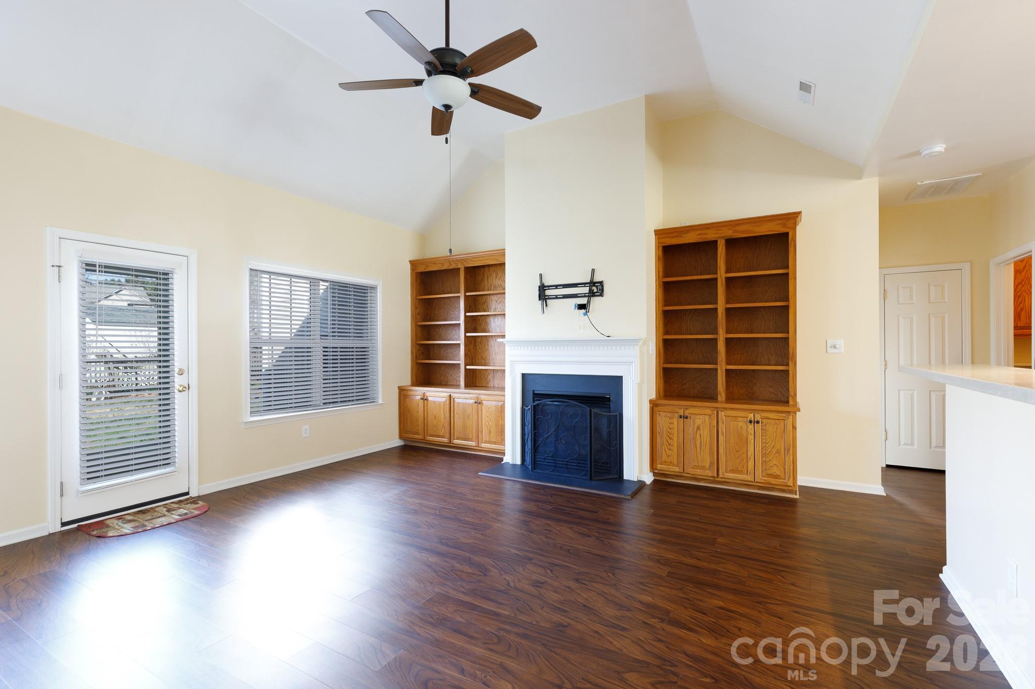 424 Elizabeth Valley Lane Clover, SC 29710 - Photo 10 of 27 a view of an empty room with wooden floor and a window