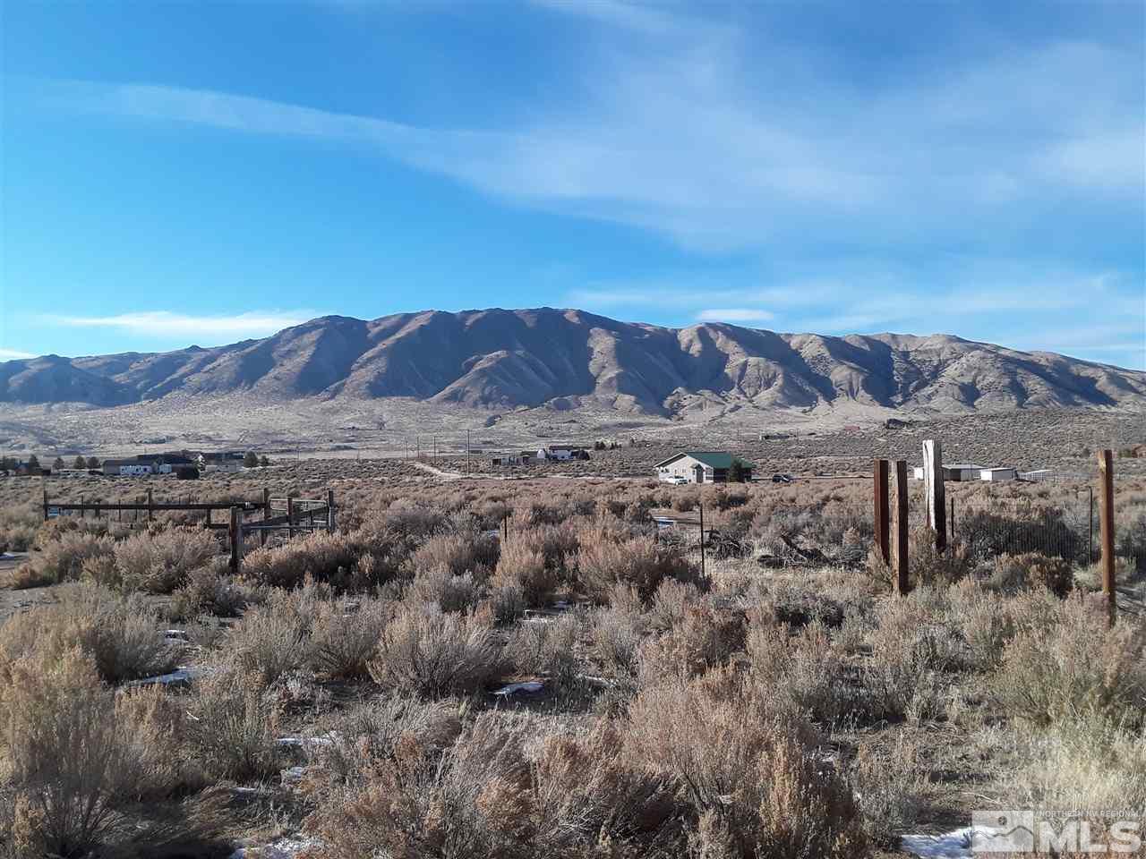 1835 Bronze Hill Road Reno, NV 89506 - Photo 1 of 1 a view of a dry yard with mountains in the background