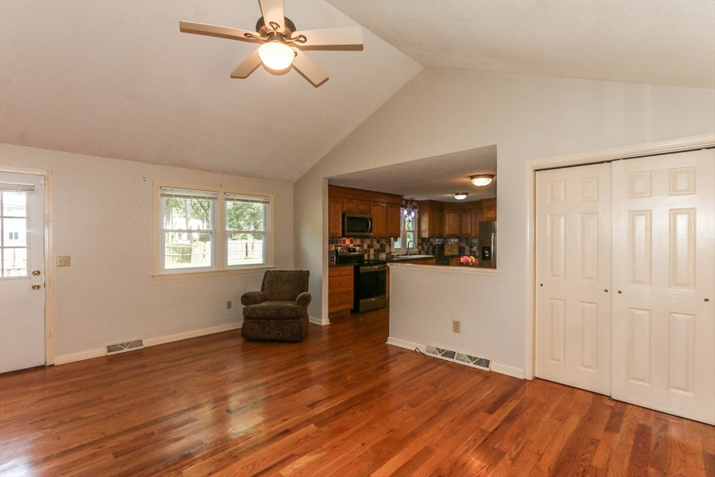 66 Metacomet Road Longmeadow, MA 01106 - Photo 6 of 40 a view of a livingroom with furniture window wooden floor and a ceiling fan