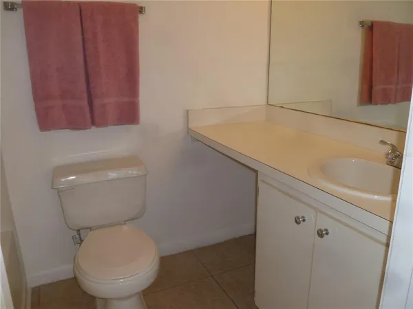 a bathroom with a toilet and sink