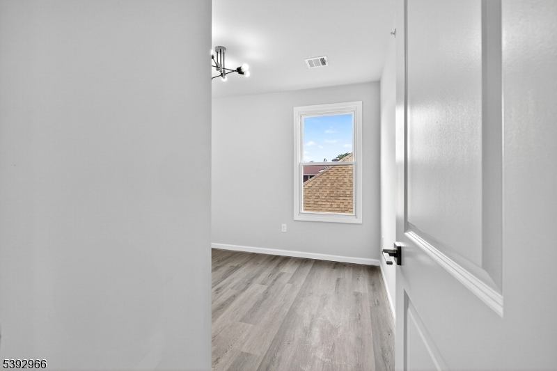 238 Renner Avenue Newark, NJ 07112 - Photo 28 of 30 a view of an empty room with a window