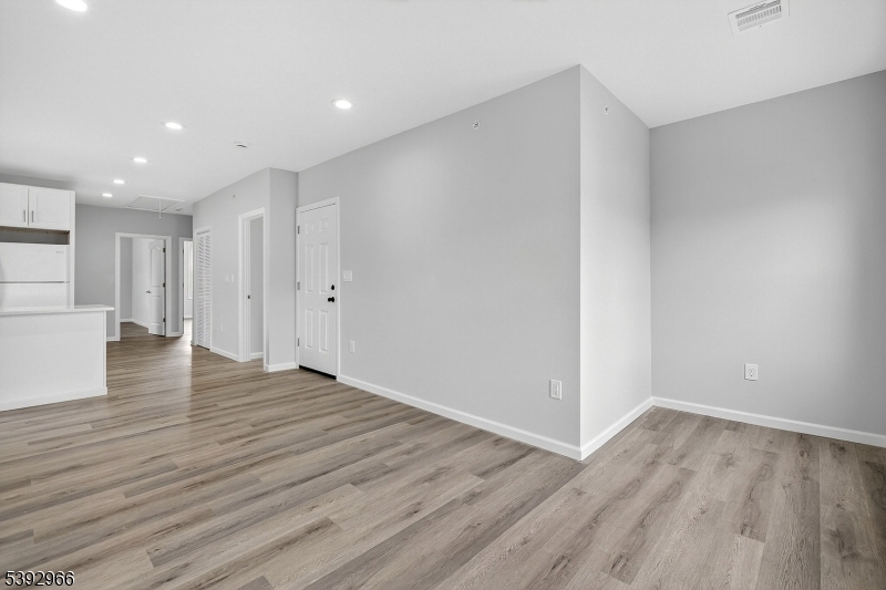 238 Renner Avenue Newark, NJ 07112 - Photo 5 of 30 a view of an empty room with wooden floor