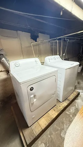 a utility room with washer and dryer