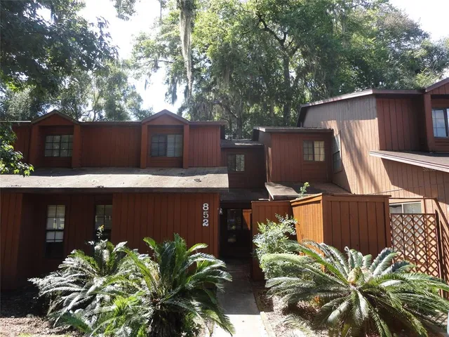 a front view of a house with yard