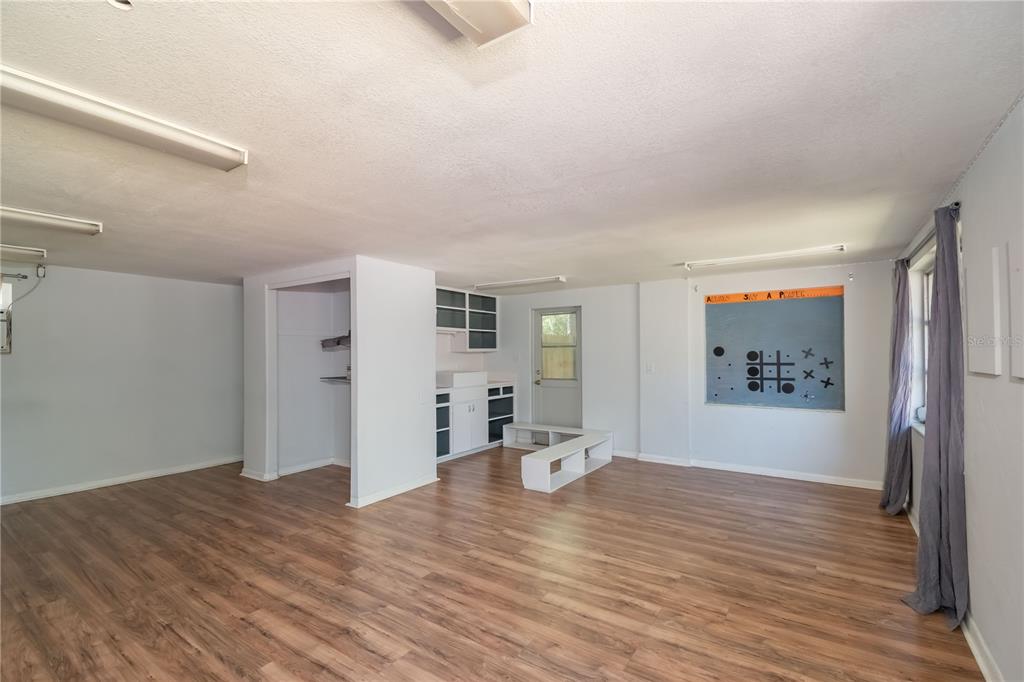 15 Ruckert Circle DeLand, FL 32720 - Photo 13 of 61 a view of an empty room with window and wooden floor