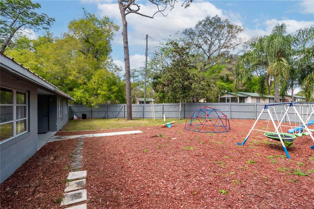 15 Ruckert Circle DeLand, FL 32720 - Photo 20 of 61 a view of backyard with slide