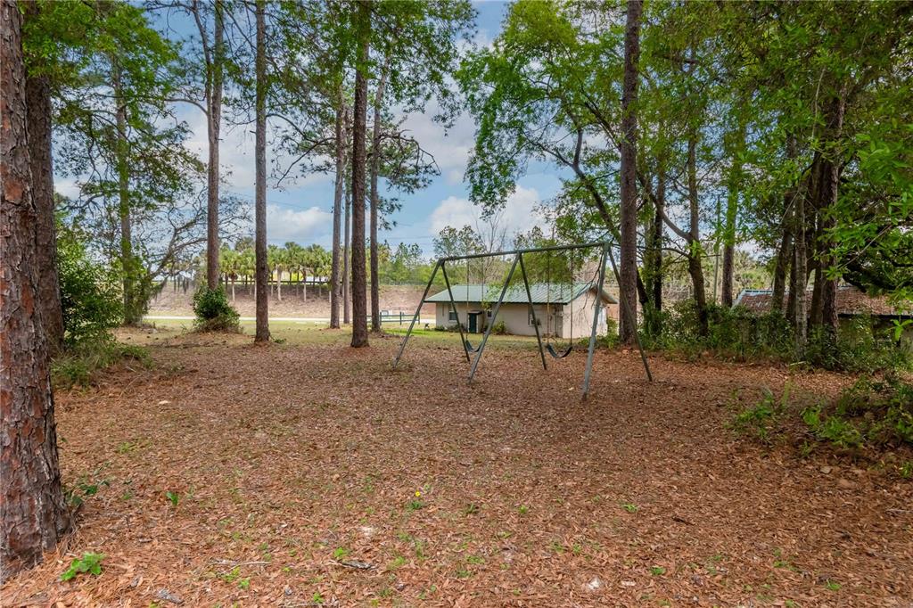 15 Ruckert Circle DeLand, FL 32720 - Photo 25 of 61 a view of outdoor space with playground and green space
