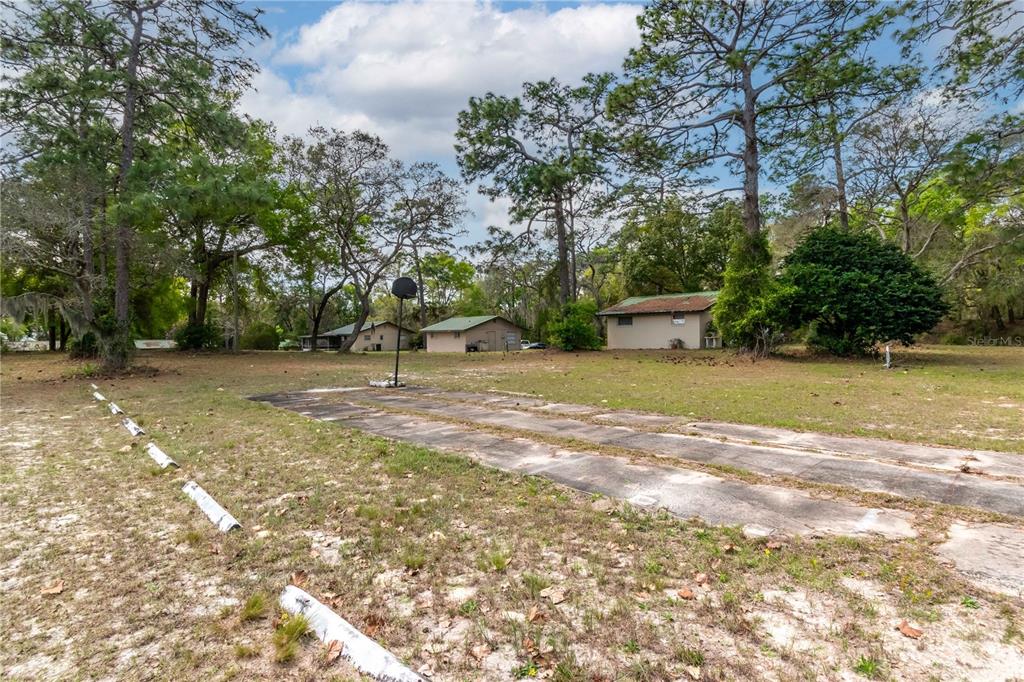 15 Ruckert Circle DeLand, FL 32720 - Photo 26 of 61 a view of a field with trees in front of it