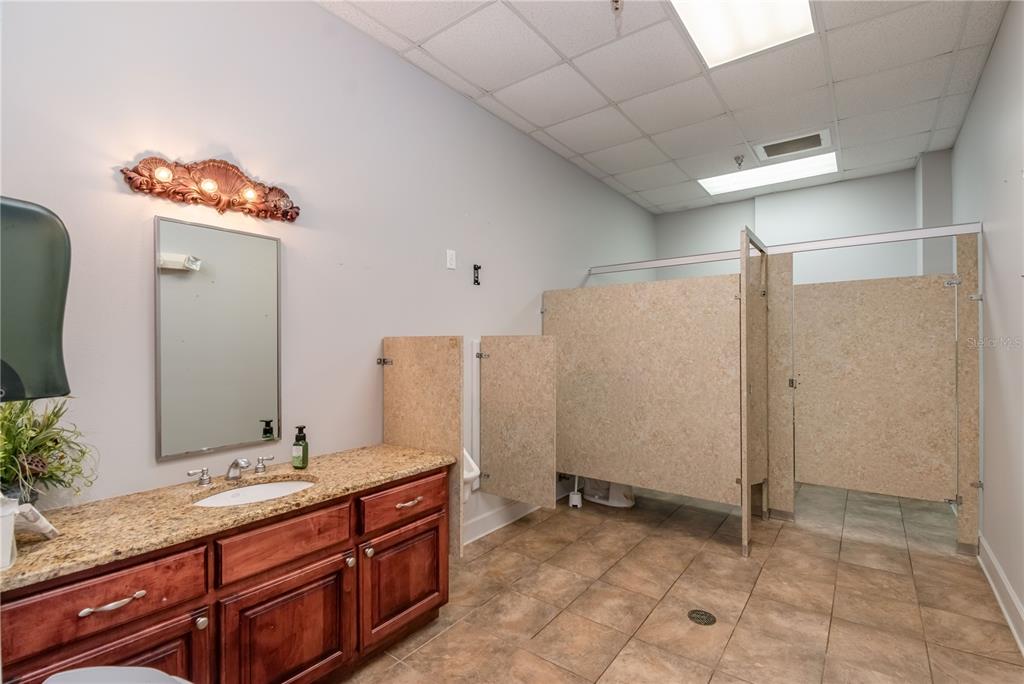 15 Ruckert Circle DeLand, FL 32720 - Photo 31 of 61 a bathroom with a granite countertop sink and a mirror