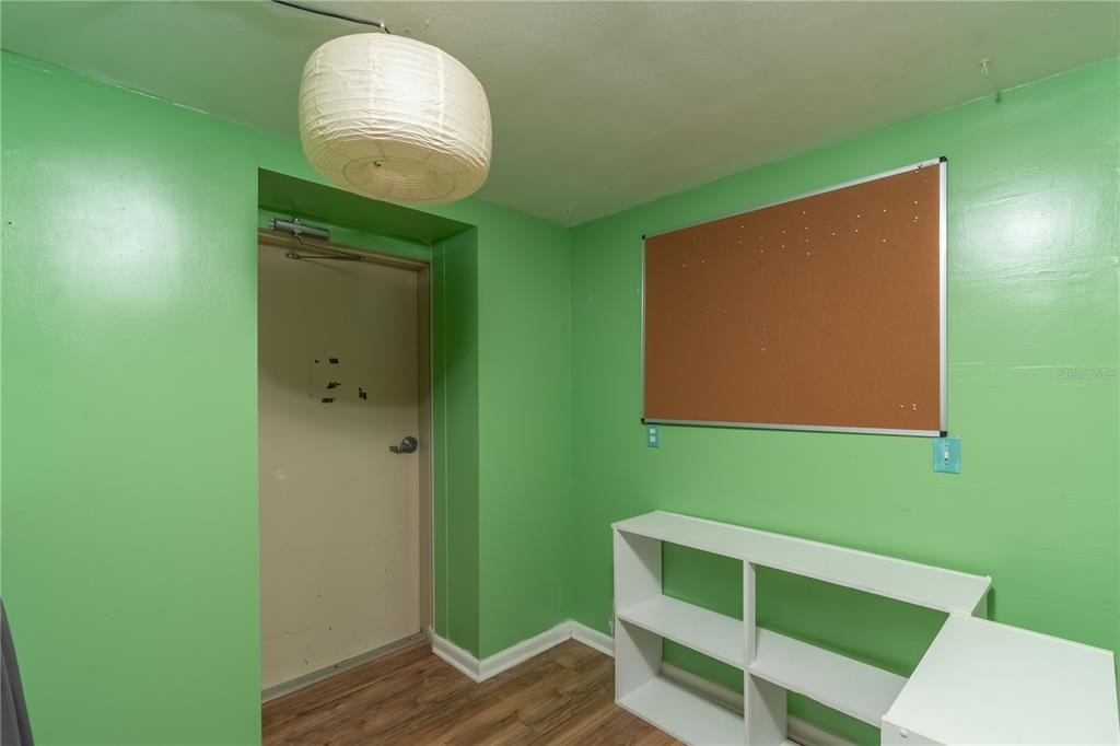 15 Ruckert Circle DeLand, FL 32720 - Photo 41 of 61 a room with wooden floor and furniture