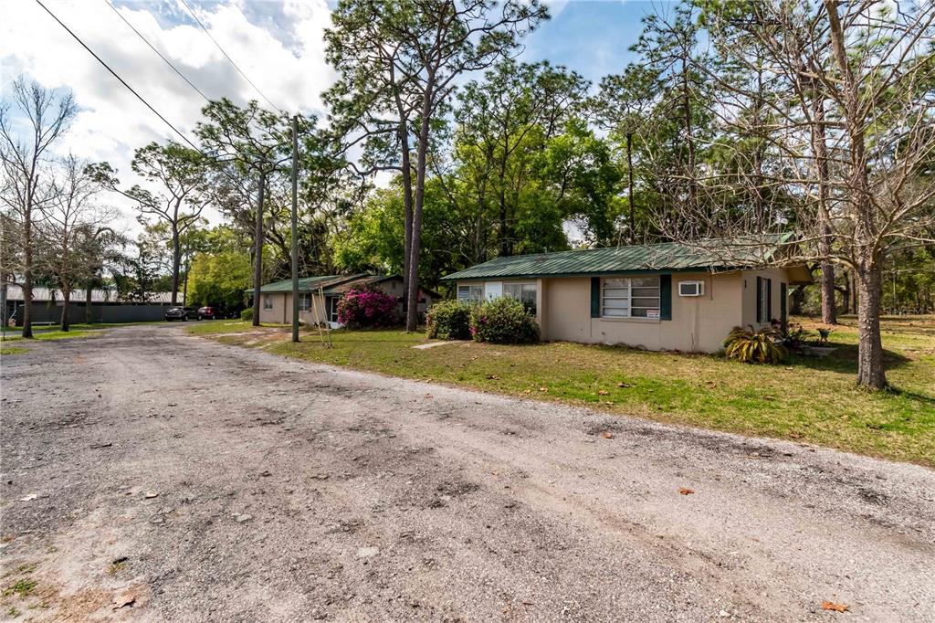 15 Ruckert Circle DeLand, FL 32720 - Photo 44 of 61 a view of a house with backyard and trees