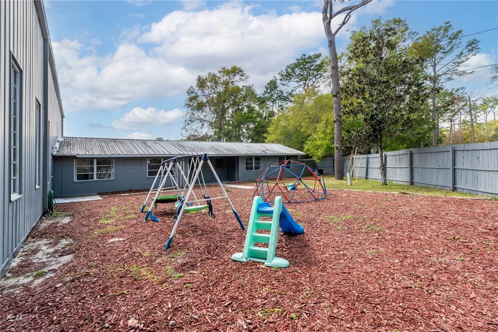 15 Ruckert Circle DeLand, FL 32720 - Photo 46 of 61 a view of a backyard with a trampoline