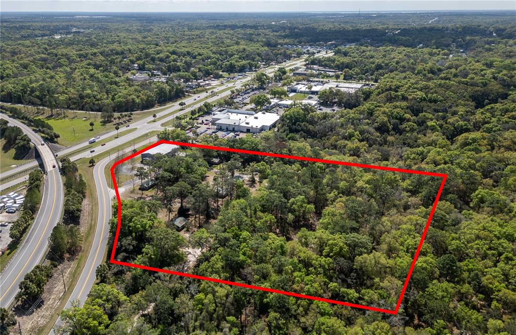 15 Ruckert Circle DeLand, FL 32720 - Photo 60 of 61 an aerial view of a houses with a yard and mountain