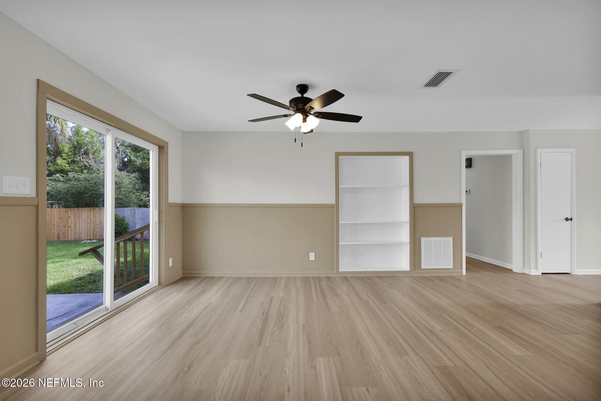 8544 Sanchez Road Jacksonville, FL 32217 - Photo 20 of 46 wooden floor in an empty room with a window