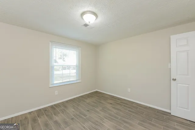 a white toilet sitting next to a bath tub