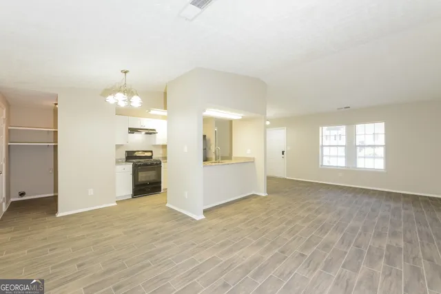 a view of kitchen with cabinets