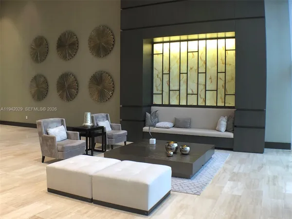 a living room with furniture and a large window