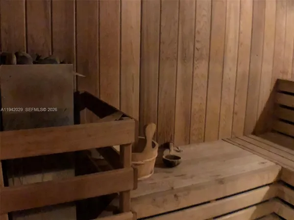 a view of a room with a door and a chair