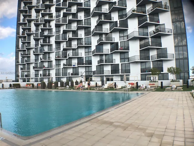 a view of a swimming pool and outdoor space