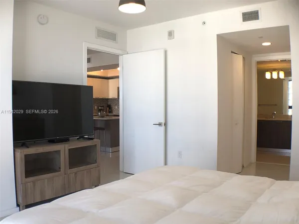 a kitchen with stainless steel appliances a refrigerator and a stove