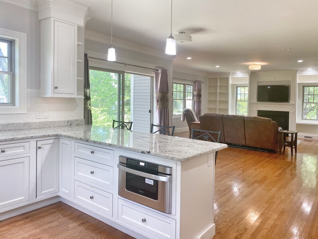 17 Barbara Road Newton, MA 02465 - Photo 12 of 40 a kitchen with stainless steel appliances granite countertop a stove and a sink