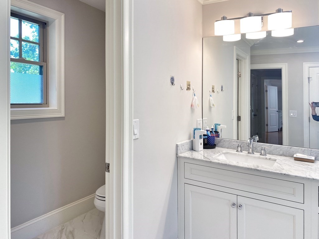 17 Barbara Road Newton, MA 02465 - Photo 24 of 40 a bathroom with a sink vanity and a mirror