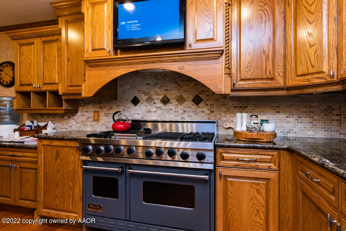 Flowers Ranch Miami, TX 79059 - Photo 33 of 285 a kitchen with stainless steel appliances granite countertop a stove and a microwave