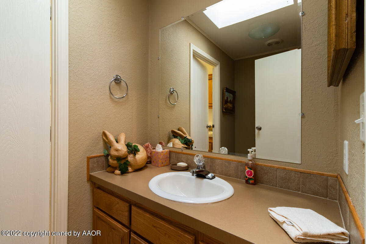Flowers Ranch Miami, TX 79059 - Photo 73 of 285 a bathroom with a sink and a mirror