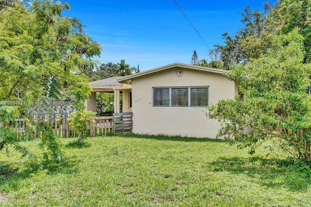 8347 East Dixie Highway Miami, FL 33138 - Photo 12 of 15 a front view of a house with a yard