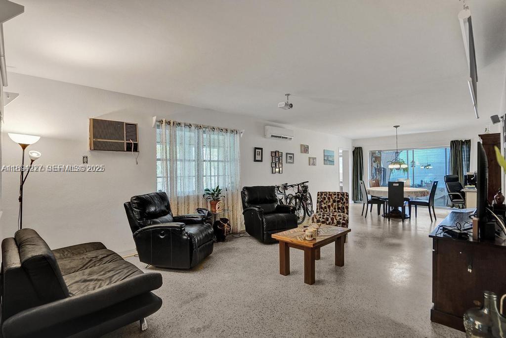 8347 East Dixie Highway Miami, FL 33138 - Photo 4 of 15 a living room with furniture and a flat screen tv