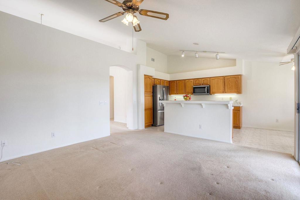 31852 Corte Montecito Temecula, CA 92592 - Photo 13 of 37 FAMILY ROOM AND KITCHEN BAR