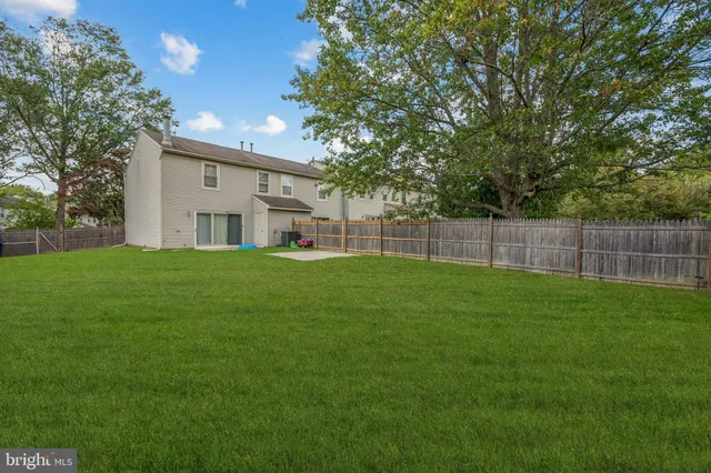 a view of a backyard with a small cabin