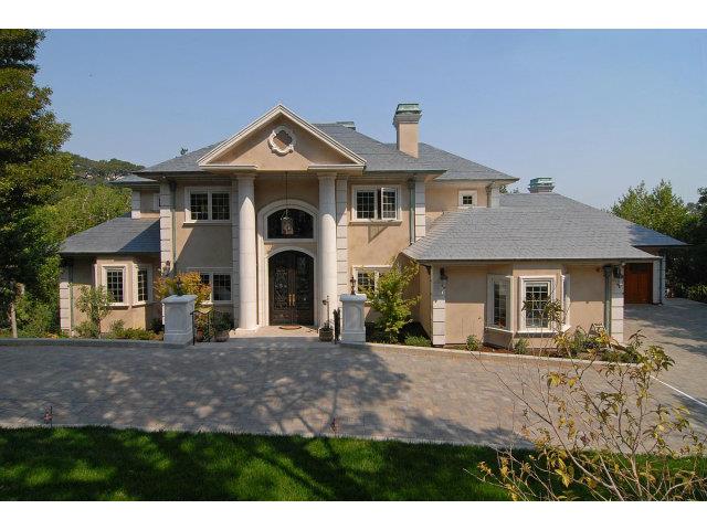 630 Pullman Road Hillsborough, CA 94010 - Photo 1 of 24 a front view of a house with a yard