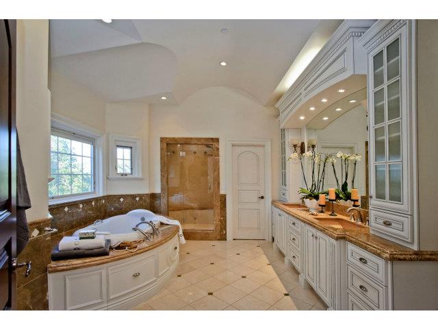 630 Pullman Road Hillsborough, CA 94010 - Photo 19 of 24 a bathroom with a sink mirror and a bathtub