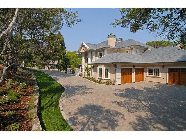 630 Pullman Road Hillsborough, CA 94010 - Photo 2 of 24 a front view of a house with a yard