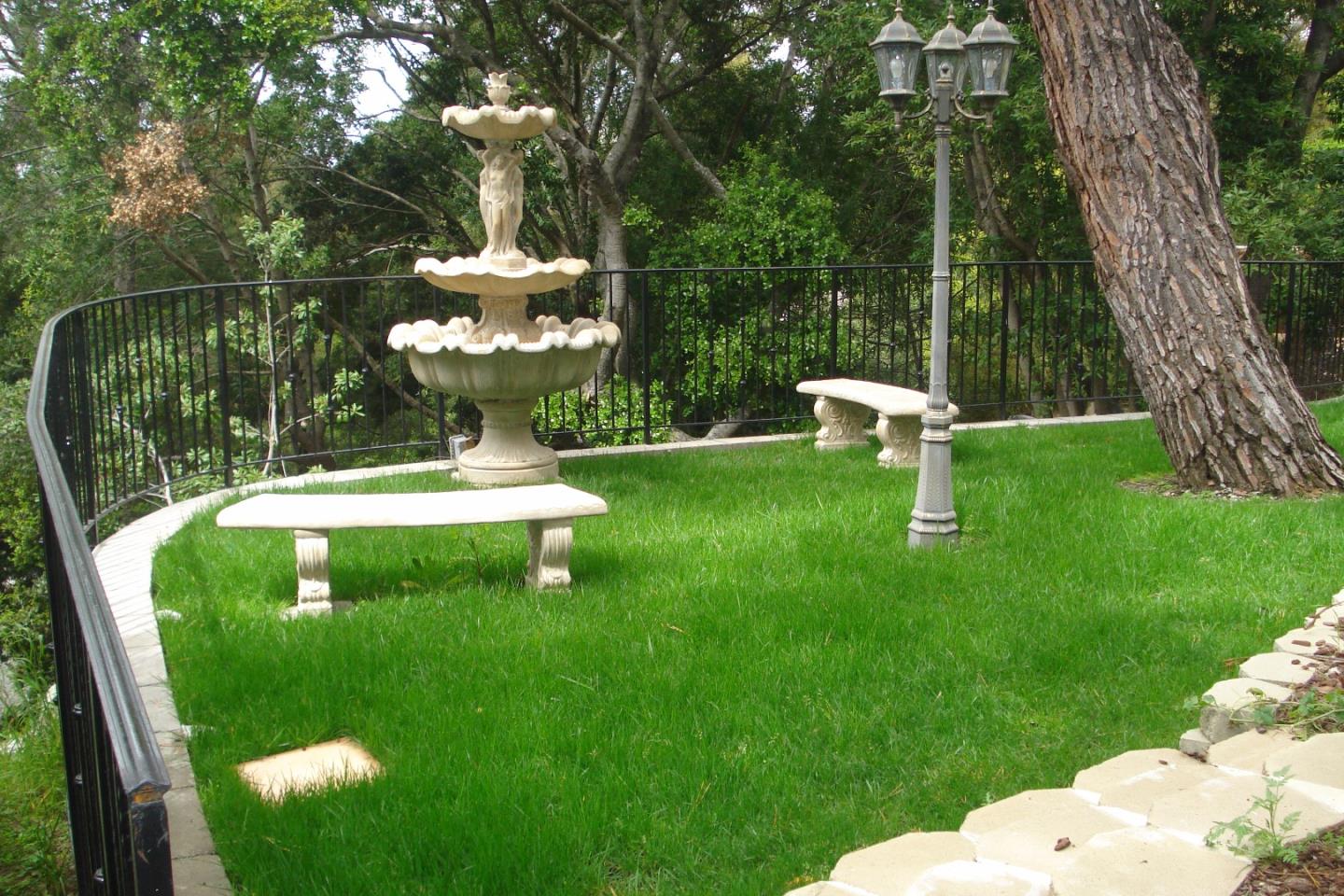 630 Pullman Road Hillsborough, CA 94010 - Photo 6 of 24 a view of a park with a slide and bench