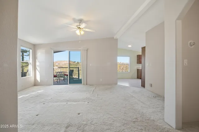 a kitchen with granite countertop a sink stove and microwave