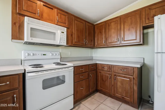 a bathroom with a granite countertop sink toilet a mirror and shower