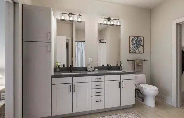 a bathroom with a granite countertop sink a toilet and a mirror