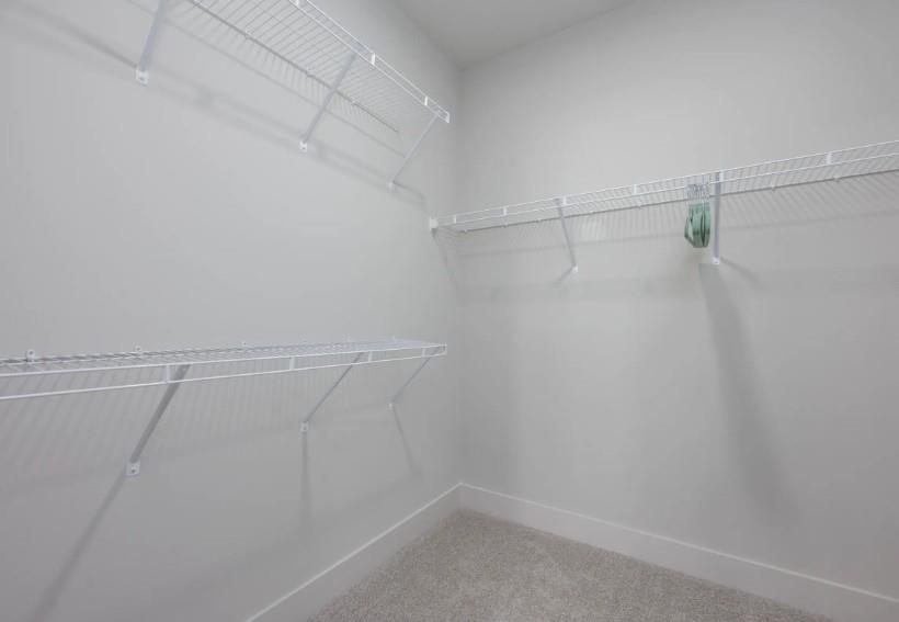 1400 Laurel Crossing Parkway Northeast, Unit 1105 Buford, GA 30519 - Photo 15 of 33 a view of a room with racks on the wall