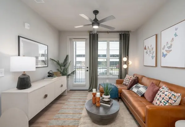 a living room with furniture and a large window