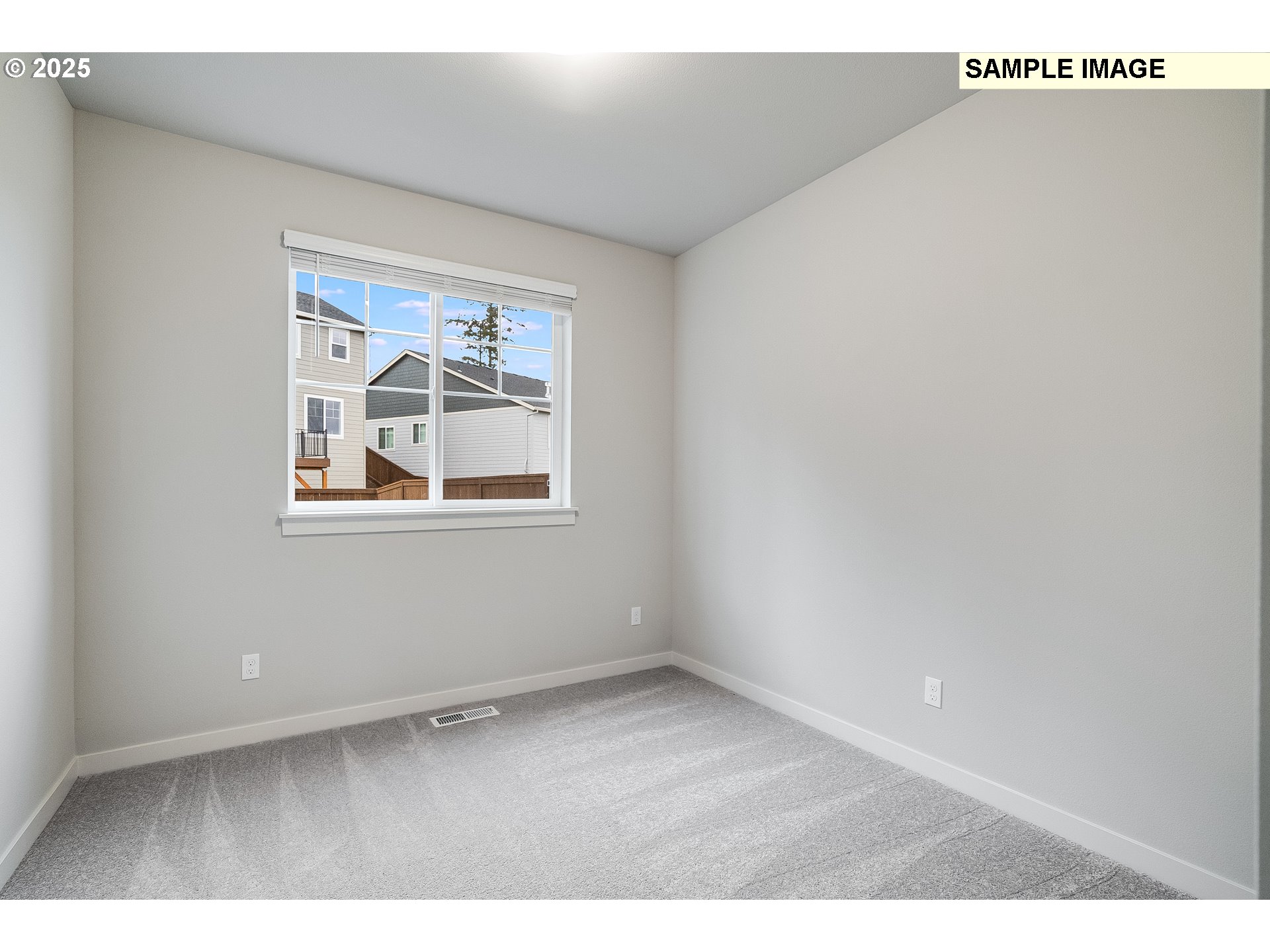16921 Southwest Lorikeet Lane Beaverton, OR 97007 - Photo 13 of 23 a view of an empty room with a window