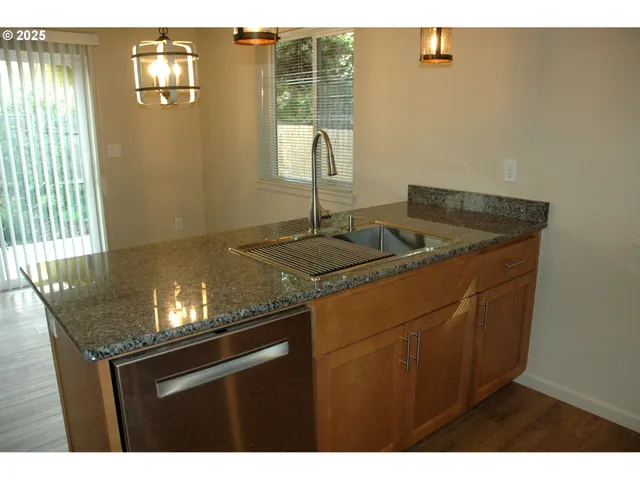 a kitchen with sink and window