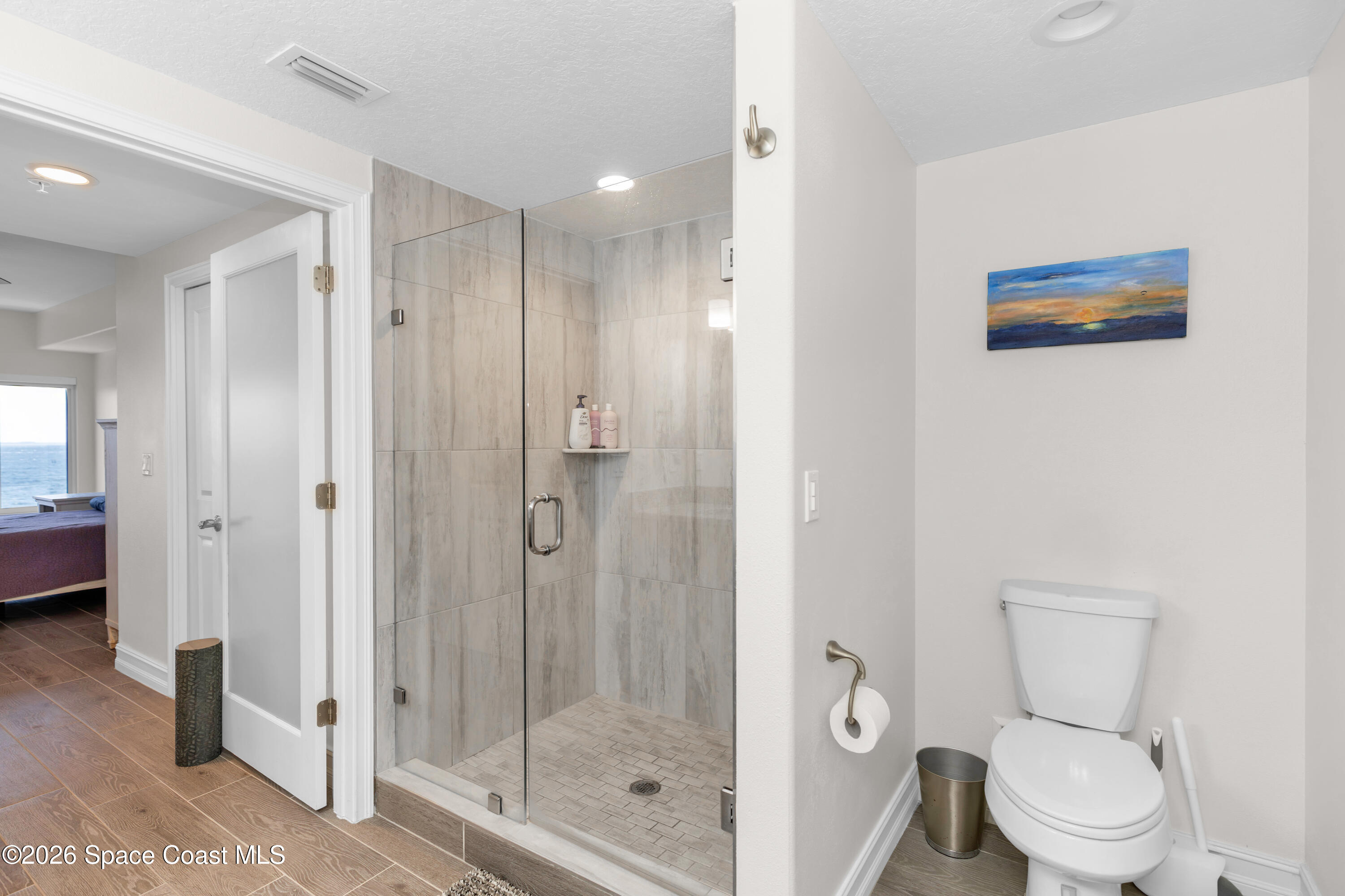 1805 Riverside Drive, Unit 506 Titusville, FL 32780 - Photo 14 of 24 a bathroom with a toilet a sink and shower
