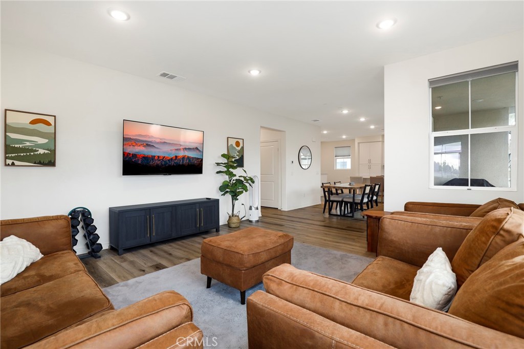 1380 Vigilant Carson, CA 90746 - Photo 12 of 43 a living room with furniture and a flat screen tv