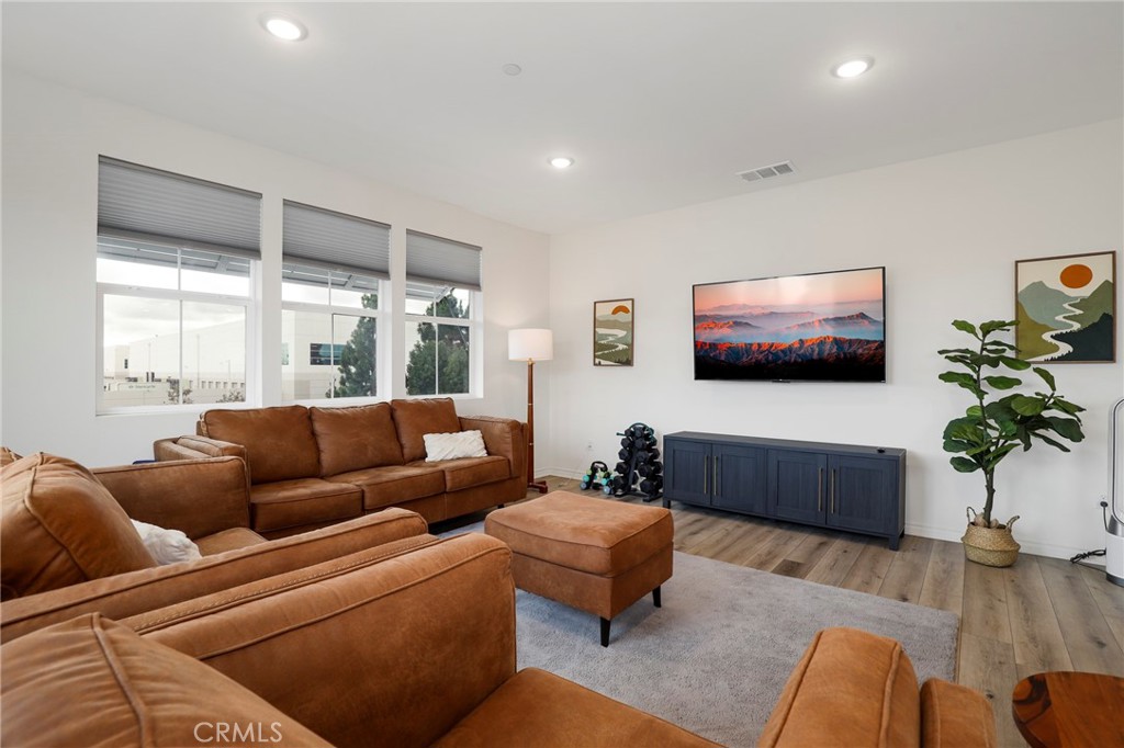 1380 Vigilant Carson, CA 90746 - Photo 14 of 43 a living room with furniture a flat screen tv and a large window