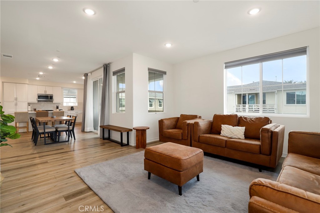 1380 Vigilant Carson, CA 90746 - Photo 15 of 43 a living room with furniture wooden floor and a table