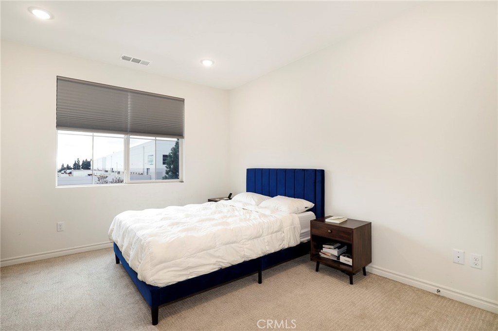 1380 Vigilant Carson, CA 90746 - Photo 20 of 43 a bedroom with a bed and window